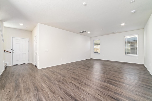 5810 Dry Brush Pl, Katy, TX 77493 - unfurnished room featuring dark wood-type flooring, recessed lighting, baseboards, and a smoke detector