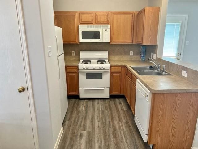 4938 Winding View Ln, Humble, TX 77346 - kitchen featuring white appliances, a sink, light countertops, wood finished floors, and tasteful backsplash