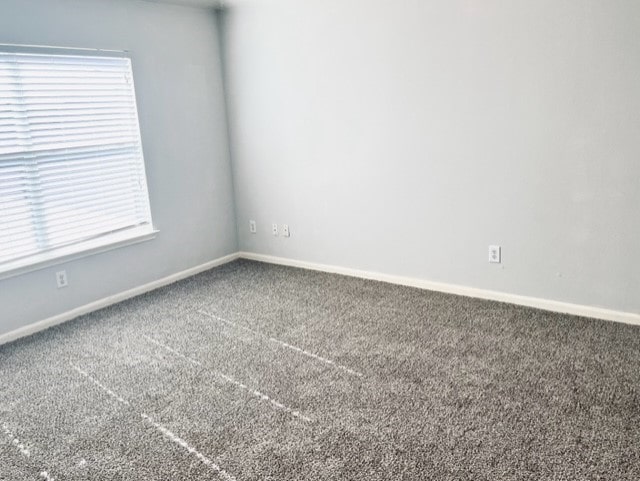 4938 Winding View Ln, Humble, TX 77346 - carpeted empty room with baseboards