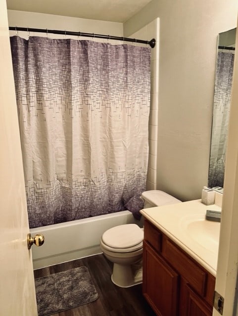 4938 Winding View Ln, Humble, TX 77346 - bathroom featuring wood finished floors, vanity, toilet, and shower / bath combo with shower curtain
