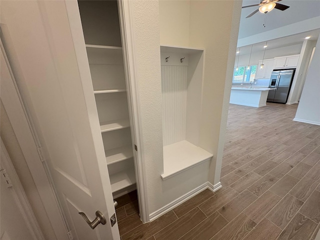 208 Cider Gum Pl, Montgomery, TX 77316 - mudroom featuring dark wood-style floors, a ceiling fan, baseboards, and a sink