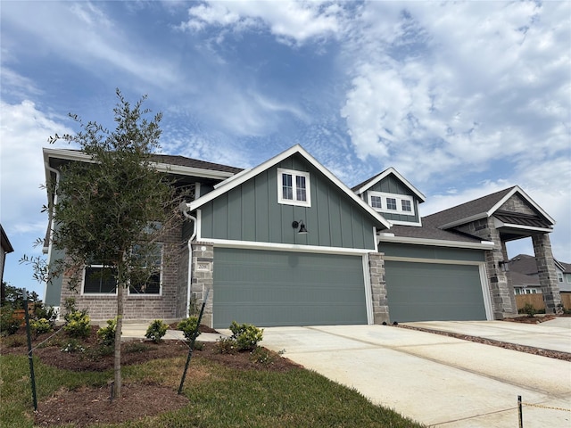 208 Cider Gum Pl, Montgomery, TX 77316 - craftsman-style house featuring board and batten siding, driveway, stone siding, and a garage