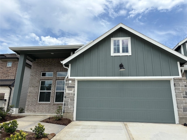 208 Cider Gum Pl, Montgomery, TX 77316 - view of front of property featuring board and batten siding, a garage, concrete driveway, and stone siding