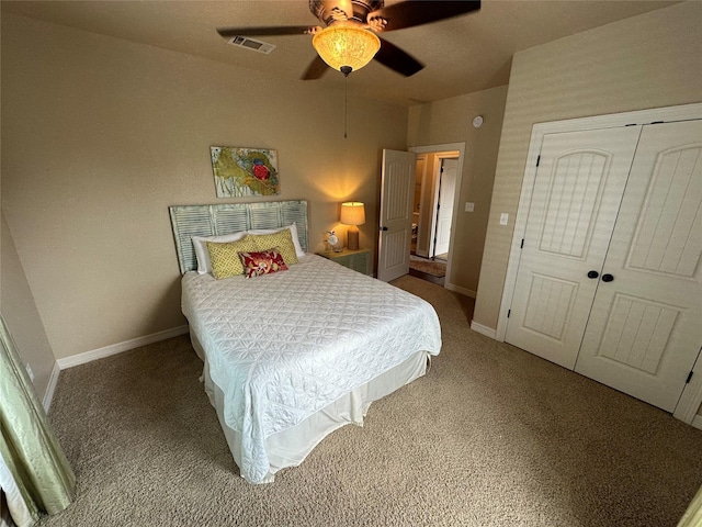 2029 Idyle Vw, Crystal Beach, TX 77650 - bedroom with carpet flooring, a closet, baseboards, and a ceiling fan