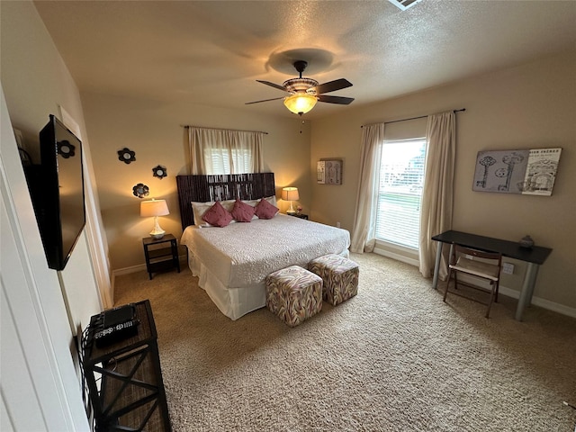 2029 Idyle Vw, Crystal Beach, TX 77650 - bedroom featuring light carpet, baseboards, and a ceiling fan