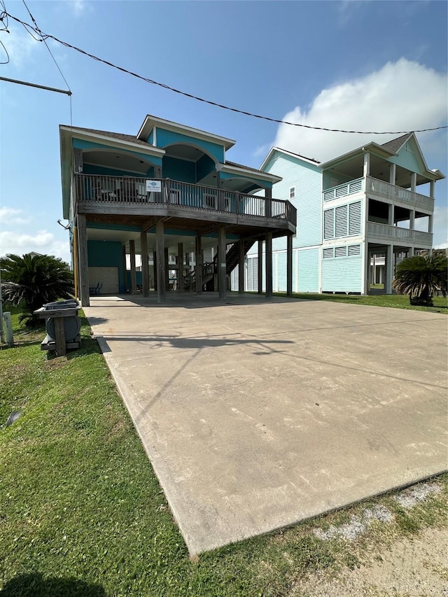 2029 Idyle Vw, Crystal Beach, TX 77650 - back of property featuring a carport and concrete driveway