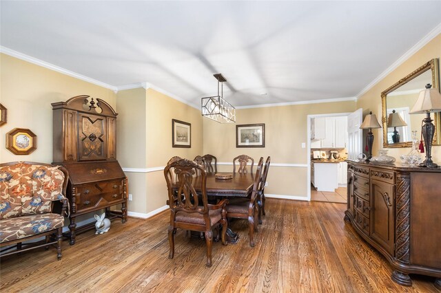 1615 Shadow Bend Dr, Houston, TX 77043 - dining space with wood finished floors, baseboards, and crown molding