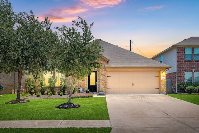 26511 Green Heron, Katy, TX 77494 - view of front of house with an attached garage, brick siding, a yard, driveway, and roof with shingles