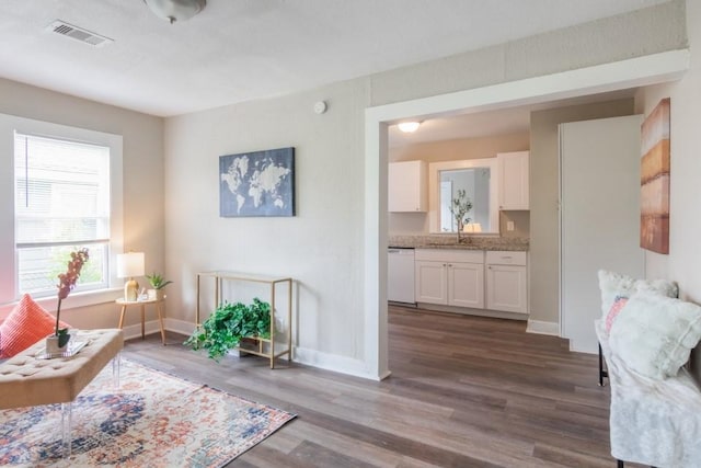 109 Porter St, La Marque, TX 77568 - sitting room with dark wood-type flooring and baseboards
