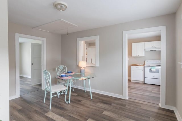109 Porter St, La Marque, TX 77568 - dining space featuring attic access, wood finished floors, and baseboards