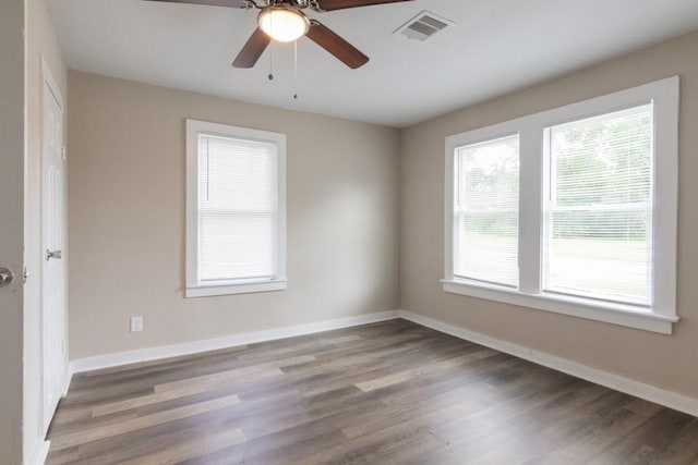 109 Porter St, La Marque, TX 77568 - empty room with wood finished floors, baseboards, and a ceiling fan