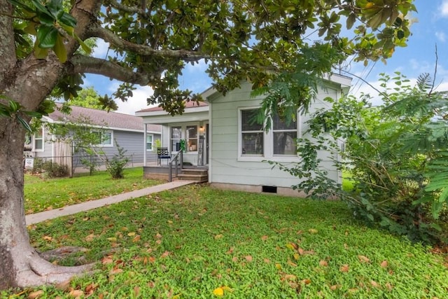 109 Porter St, La Marque, TX 77568 - view of front facade with a front lawn and crawl space