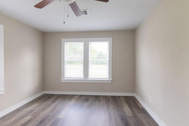 109 Porter St, La Marque, TX 77568 - spare room featuring a ceiling fan, wood finished floors, and baseboards