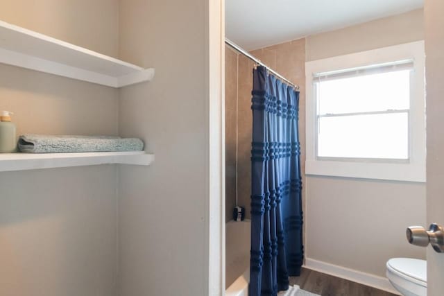 109 Porter St, La Marque, TX 77568 - full bath with wood finished floors, toilet, and baseboards