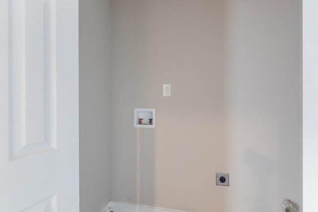 109 Porter St, La Marque, TX 77568 - clothes washing area with electric dryer hookup, washer hookup, and baseboards