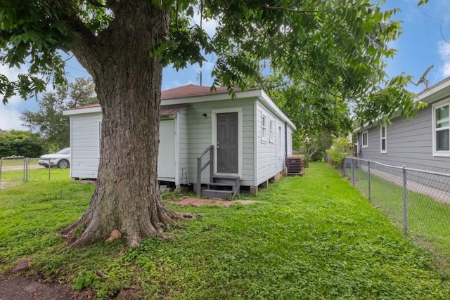 109 Porter St, La Marque, TX 77568 - rear view of house featuring entry steps and central AC
