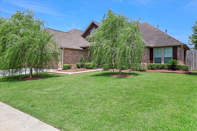 3490 Prescott Dr, Beaumont, TX 77706 - view of property hidden behind natural elements featuring brick siding and roof with shingles