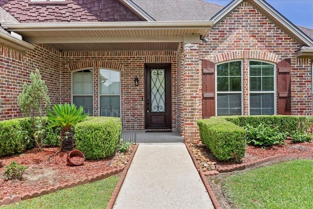 3490 Prescott Dr, Beaumont, TX 77706 - property entrance featuring brick siding and a shingled roof