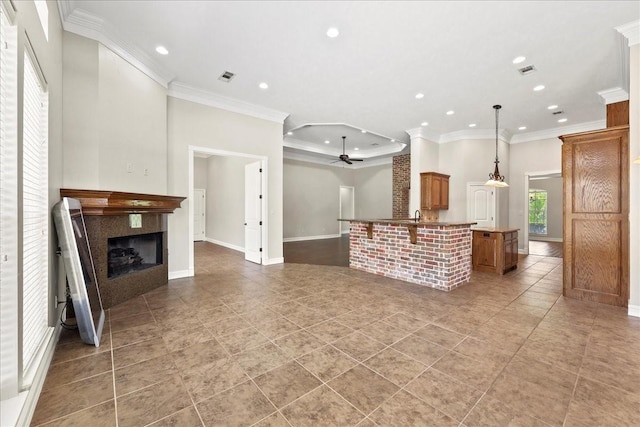 3490 Prescott Dr, Beaumont, TX 77706 - living room with a ceiling fan, ornamental molding, recessed lighting, light tile patterned floors, and a fireplace