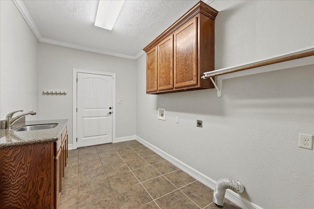 3490 Prescott Dr, Beaumont, TX 77706 - laundry room with electric dryer hookup, cabinet space, washer hookup, crown molding, and baseboards