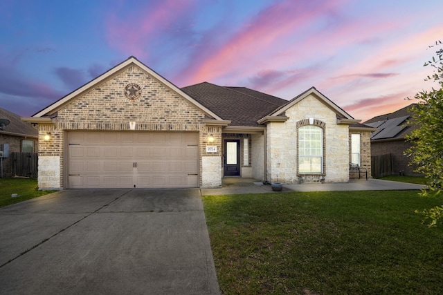 18724 Carrizo Trl, Magnolia, TX 77355 - french country style house with driveway, an attached garage, a shingled roof, stone siding, and brick siding