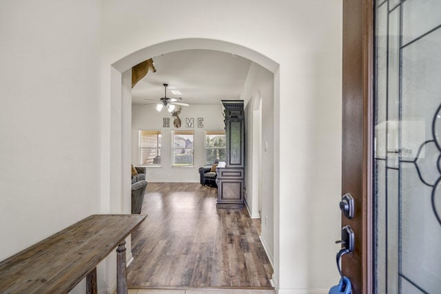 18724 Carrizo Trl, Magnolia, TX 77355 - entryway with ceiling fan, wood finished floors, arched walkways, and baseboards