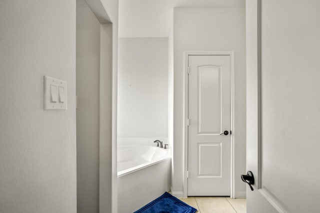 18724 Carrizo Trl, Magnolia, TX 77355 - bathroom featuring tile patterned floors and a garden tub