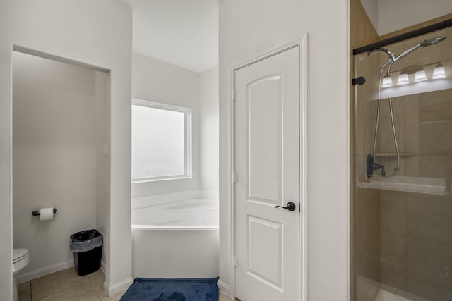 18724 Carrizo Trl, Magnolia, TX 77355 - bathroom featuring a shower stall, toilet, a bath, and tile patterned floors