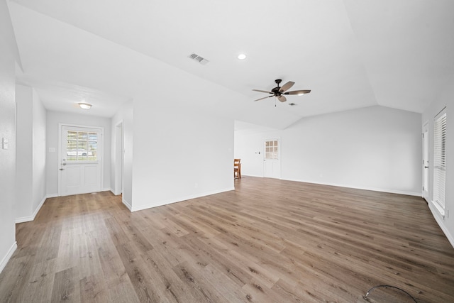 3009 Fm 50, Brenham, TX 77833 - unfurnished living room featuring a ceiling fan, wood finished floors, lofted ceiling, and baseboards