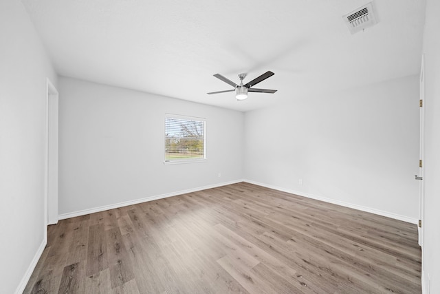 3009 Fm 50, Brenham, TX 77833 - unfurnished room featuring wood finished floors, a ceiling fan, and baseboards