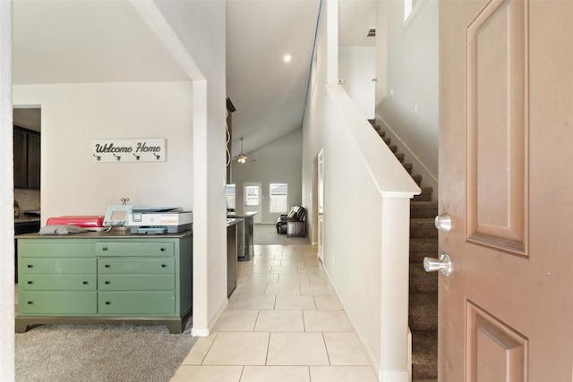 2910 High Garden Ln, Fresno, TX 77545 - hall featuring light tile patterned flooring, lofted ceiling, stairs, and baseboards