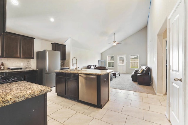 2910 High Garden Ln, Fresno, TX 77545 - kitchen with stainless steel appliances, a sink, open floor plan, ceiling fan, and vaulted ceiling