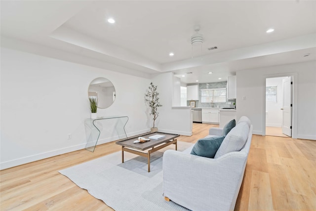 6019 Westover St, Houston, TX 77033 - living area featuring baseboards, light wood-style flooring, and recessed lighting