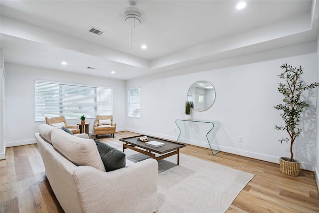 6019 Westover St, Houston, TX 77033 - living area with baseboards, wood finished floors, a raised ceiling, and recessed lighting