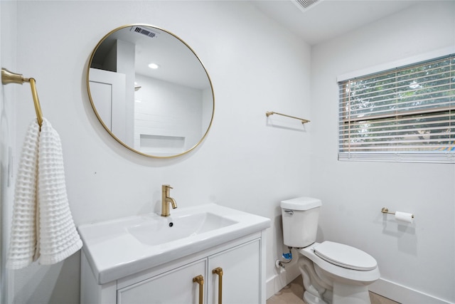 6019 Westover St, Houston, TX 77033 - half bath featuring toilet, vanity, and baseboards