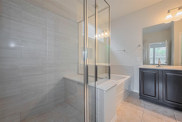 24511 Carlton Springs Ln, Katy, TX 77494 - full bathroom featuring a shower stall, tile patterned floors, a garden tub, and vanity