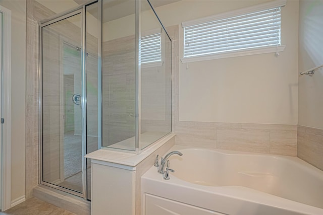 24511 Carlton Springs Ln, Katy, TX 77494 - full bath featuring healthy amount of natural light, a shower stall, and a garden tub