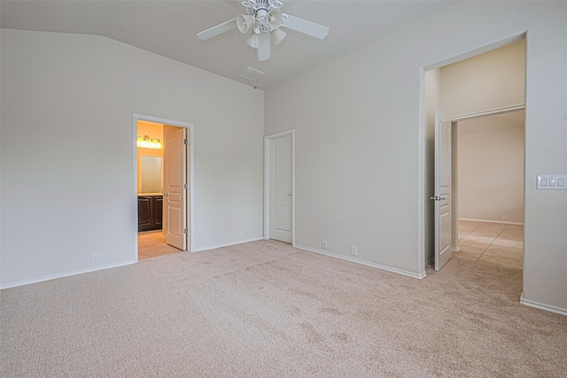 24511 Carlton Springs Ln, Katy, TX 77494 - unfurnished bedroom featuring light carpet, baseboards, connected bathroom, a ceiling fan, and high vaulted ceiling