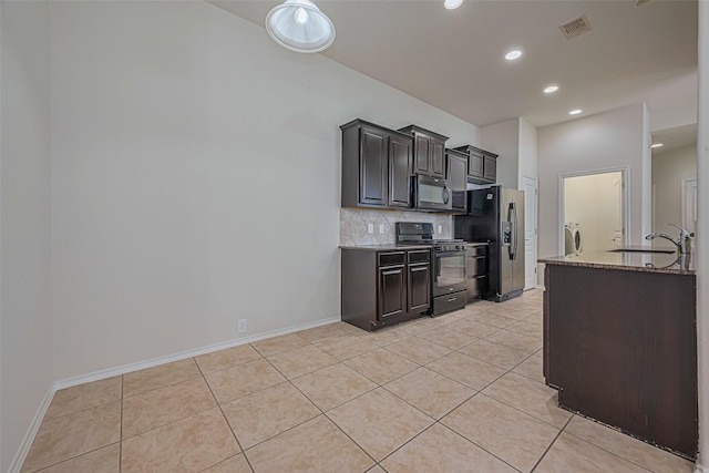 24511 Carlton Springs Ln, Katy, TX 77494 - kitchen with black range with gas stovetop, stainless steel refrigerator with ice dispenser, a sink, backsplash, and light tile patterned flooring