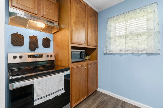 21 Clearview St, Point Blank, TX 77364 - kitchen featuring stainless steel appliances, under cabinet range hood, dark wood-type flooring, brown cabinets, and crown molding