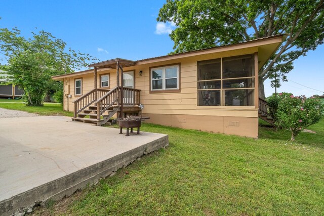21 Clearview St, Point Blank, TX 77364 - ranch-style home with crawl space, a front lawn, metal roof, and a patio