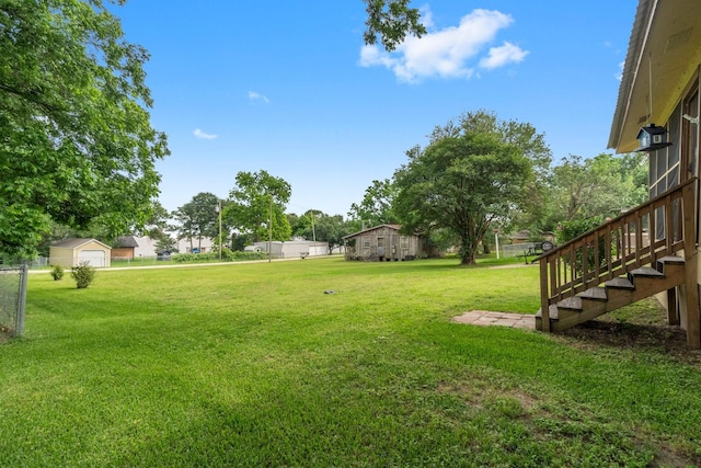 21 Clearview St, Point Blank, TX 77364 - view of green lawn featuring stairway and a garage