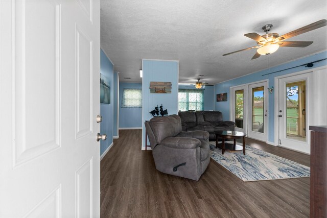 21 Clearview St, Point Blank, TX 77364 - living area featuring wood finished floors, ceiling fan, baseboards, and a textured ceiling