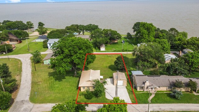 21 Clearview St, Point Blank, TX 77364 - aerial view of residential area with a nearby body of water and property parcel outlined