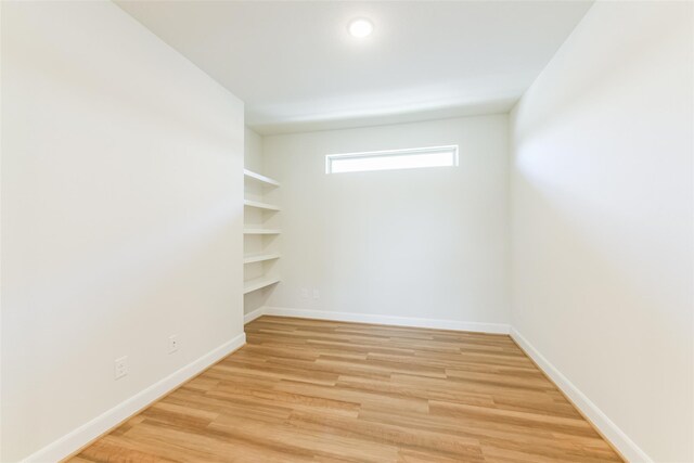 5746 Bobwhite Trl, Manvel, TX 77578 - unfurnished room featuring light wood-style flooring and baseboards