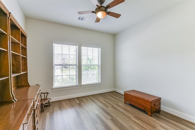5746 Bobwhite Trl, Manvel, TX 77578 - unfurnished room with wood finished floors, a ceiling fan, and baseboards