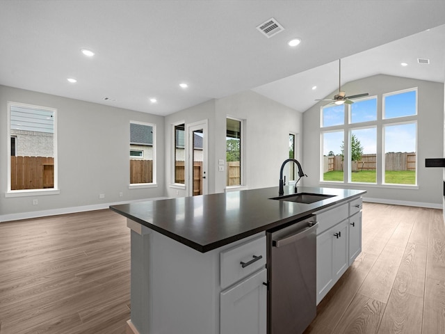 14690 Hereford Grove Ln, Montgomery, TX 77316 - kitchen with stainless steel dishwasher, a sink, open floor plan, plenty of natural light, and recessed lighting
