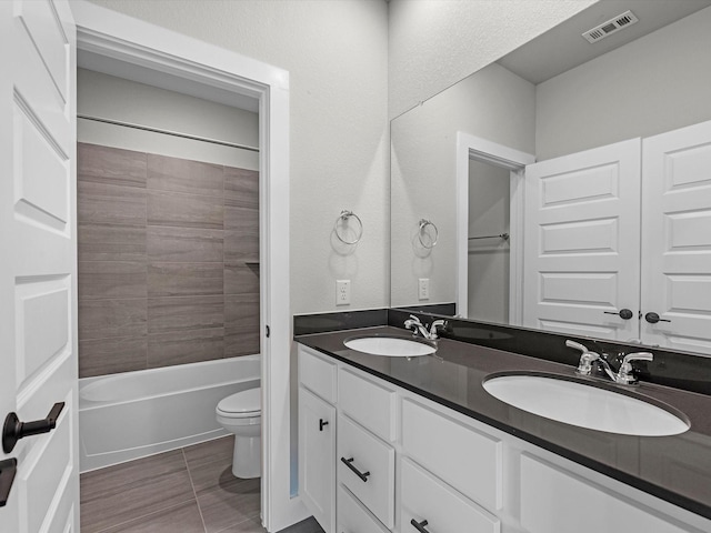 14690 Hereford Grove Ln, Montgomery, TX 77316 - bathroom with toilet, double vanity,  shower combination, and tile patterned floors