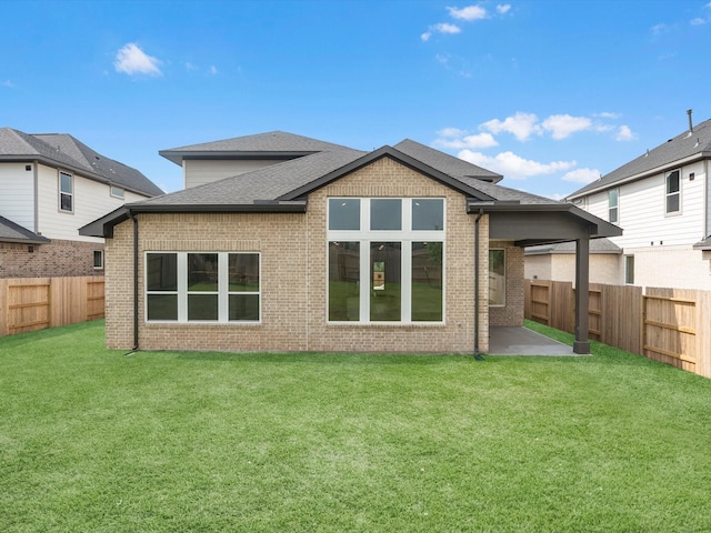 14690 Hereford Grove Ln, Montgomery, TX 77316 - back of house featuring brick siding, a patio, and a shingled roof