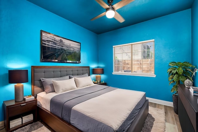 5106 Hardy St, Houston, TX 77009 - bedroom featuring wood finished floors, baseboards, and ceiling fan